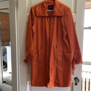 Cole Haan orange rain jacket. Super cute